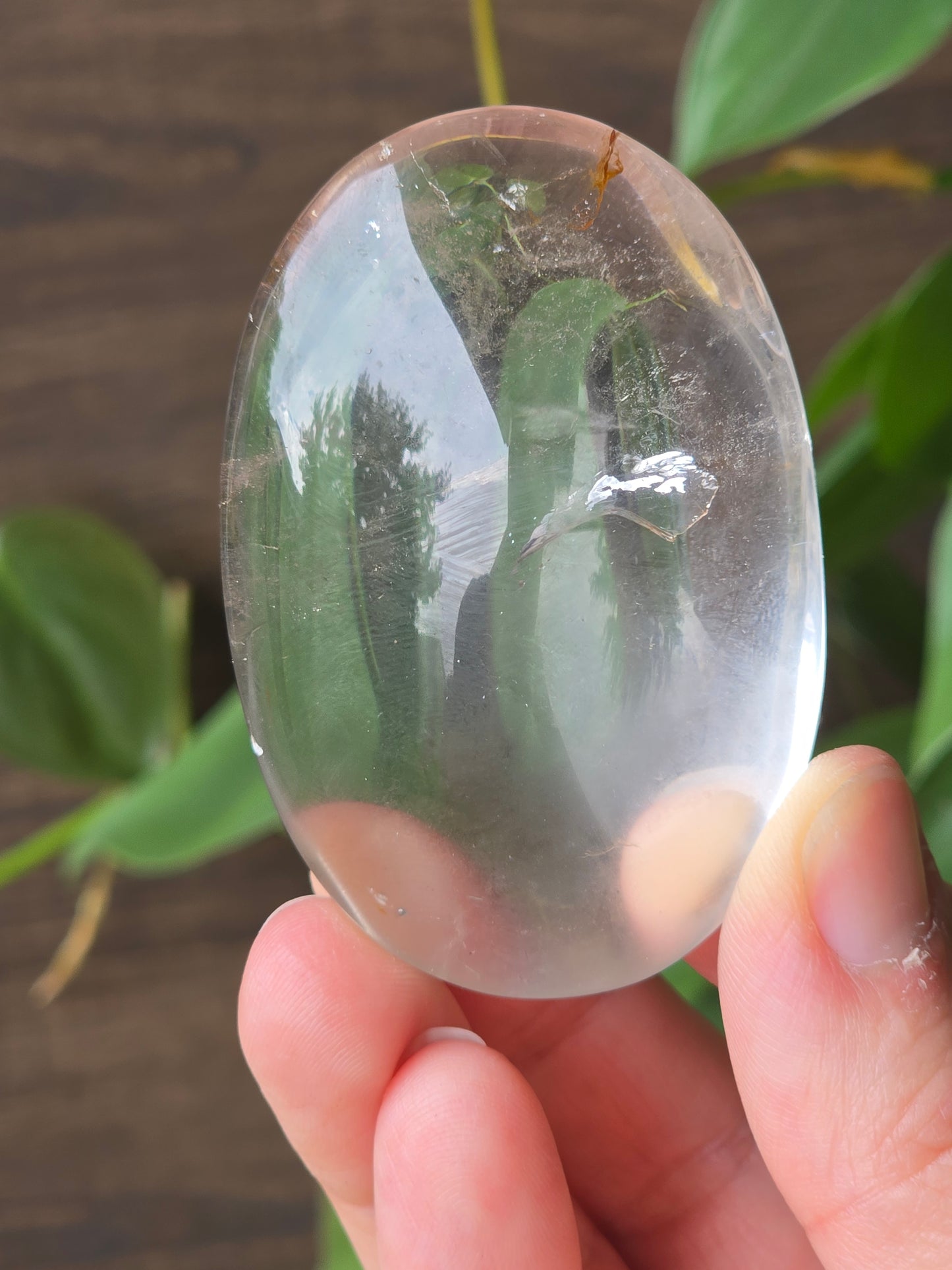 Clear Quartz Palm Stone With Hematite
