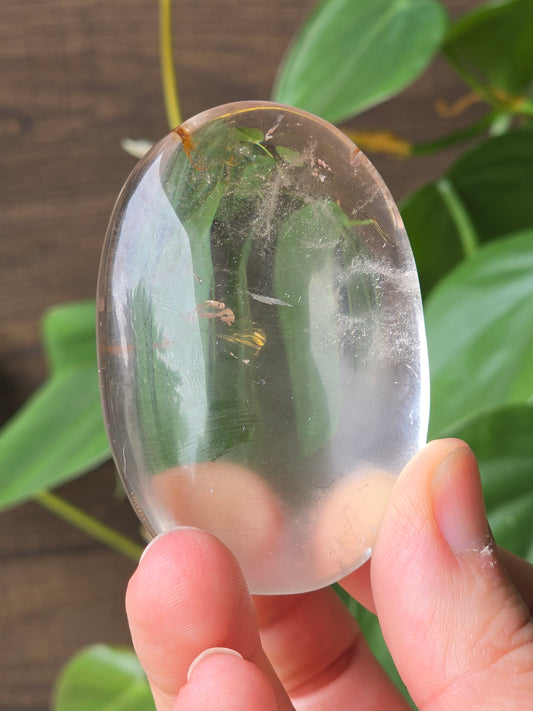 Clear Quartz Palm Stone With Hematite